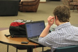 Senior Rob White enjoys St. Thomas' bandwidth access in the Murray-Herrick Center. St. Thomas students hoped their bandwidth access would not become prioritized like South Dakota State University's. (Trevor Walstrom/TommieMedia)