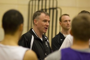 Coach John Tauer discusses the blueprint of the Calvin College offense and defense during practice Monday. Two games into the NCAA tournament, the Tommies tenacious defense has allowed opponents to average only sixty points a game. (Jesse Krull/TommieMedia)