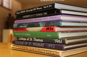 <p>All old St. Thomas yearbooks, such as these, will be archived online after the switch to digital. (Ashley Stewart/TommieMedia)</p>