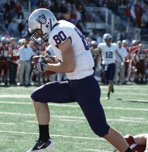 <p>Wide receiver Logan Marks catches the final touchdown of the first half putting the Tommies up 41-7. (John Kruger/TommieMedia) </p>