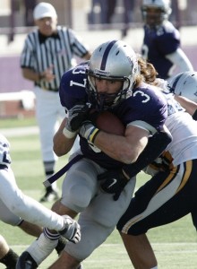 Senior Colin Tobin busts through the line last year against Carleton. (John Kruger/TommieMedia)