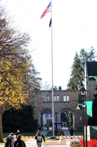 Members of the ROTC march back and forth in opposite directions underneath the flag pole on lower quad. (Kristi Battarbee/TommieMedia)