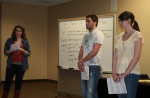 110303_NEW_CURRICULUM Entrepreneurship 200 students Angie Hasek, Peter Burke and Kara Gamelin present their business proposal based on a lemonade stand concept to their group's mentor. (Kelsey Broadwell/TommieMedia)