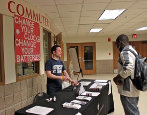 110310_MICHAEL_LARSON_EVENT_002 <p>Mike Orth, Undergraduate Student Government sophomore class president, talks to a student about fire safety. (Theresa Malloy/TommieMedia)</p>