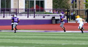 <p>Senior quarterback Dakota Tracy runs in the first touchdown of the Tommie football season. (Theresa Malloy/TommieMedia)</p>