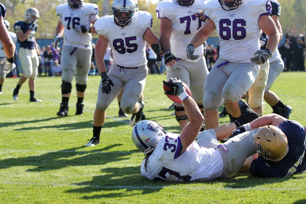 111022_FOOTBALL_BETHEL-8 <p>Senior Colin Tobin slides into the end zone for a touchdown. (Rita Kovtun/TommieMedia)</p>