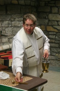 Fr. Rutten blesses Cretin Hall. (Tom Graves/TommieMedia)