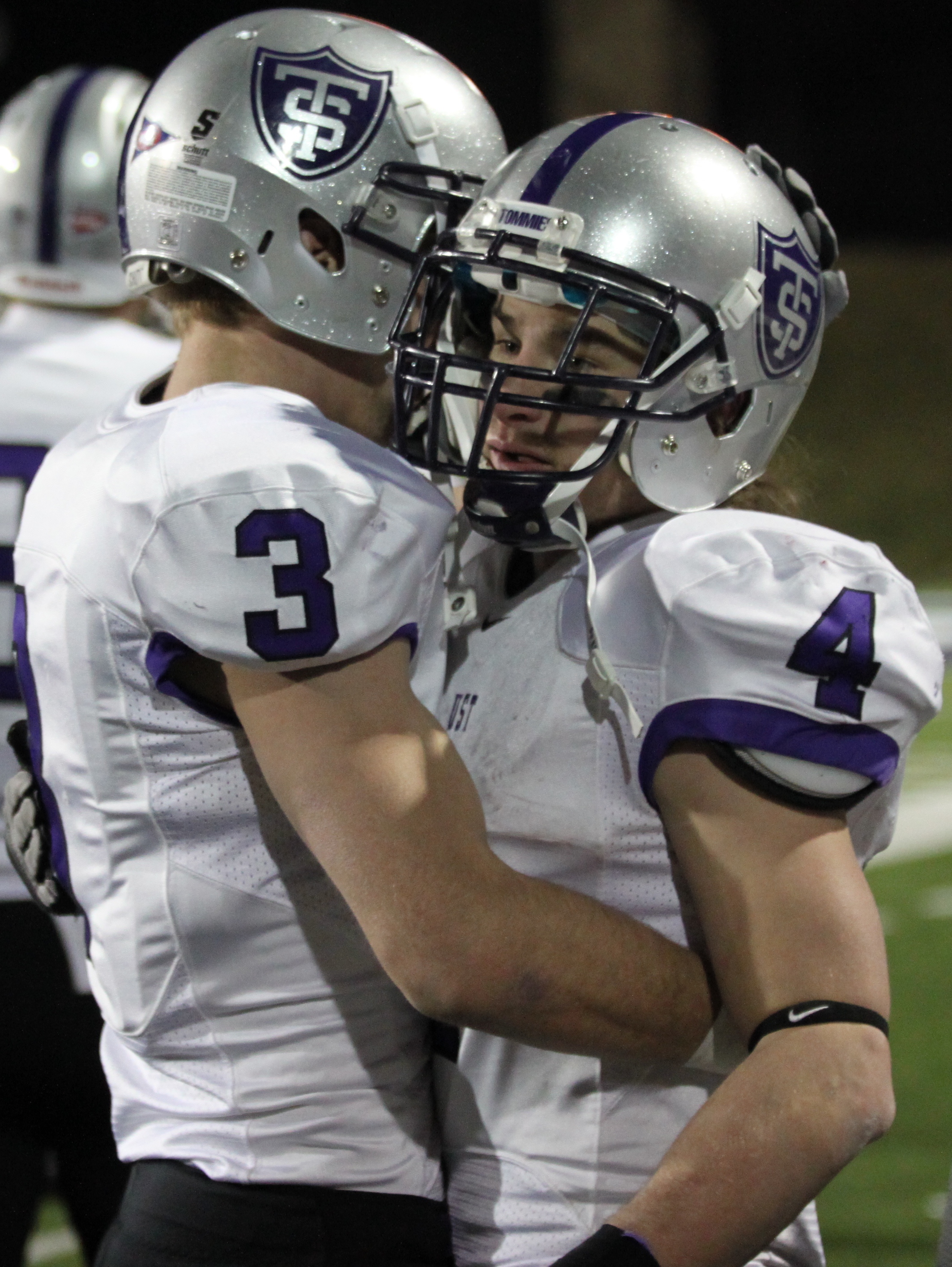 Sophomore wide receiver Dan Noerhing hugs senior wide receiver Fritz Waldvogel after St. Thomas was knocked out of the NCAA semifinals by Whitewater. Waldvogel ended his career as the most prolific receiver in school history. (Ryan Shaver/TommieMedia)