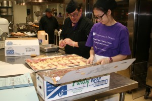 <p>Catering Service employees work on preparing sandwiches for an on-campus club meeting, Monday, Feb. 7.  (Jake Swansson/ TommieMedia)</p>