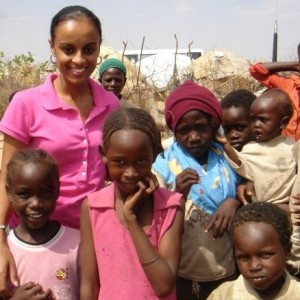 St. Thomas graduate Semhar Araia visits with the local children in Darfur. She asked one of the community elders how she could help the conflict in Sudan. His answer greatly affected Araia's life and her identity as a member of the African diaspora. (Submitted Photo)