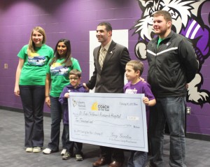 <p>Coach Glenn Caruso, who won the Liberty Mutual Coach of the Year award for the second year in a row, presented his $10,000 donation to St. Jude Children’s Research Hospital Tuesday. (Cynthia Johnson/TommieMedia)</p> 