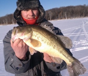 Senior Tony Trulen holds a fish caught from last year's ice fishing season. The record warm temperatures have made ice fishing in 2012 more dangerous for Minnesotans. (Submitted Photo)