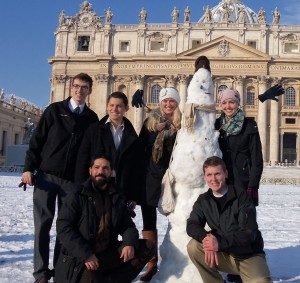 Junior Evan Beacom, sophomore Austin Weyant, sophomore Katie Erickson, Meghan Wenger,and junior Jacob Monson take a picture with their Roman Snowman designed to look like the pope (Submitted Photo)