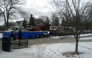 A St. Thomas shuttle is towed from the arches on Feb. 24 due to a leak, which made it inoperable.  St. Thomas’ bus vendor, Lorenz Bus Service, had to replace two buses on its route on Feb. 24 after one had to be towed and another one was in an accident on the Interstate 94 bridge. (Courtesy of Spencer Peka) 