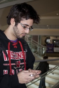 Freshman Riley Kaniewski checks his latest text messages. He said that lying, whether in person or in text, is always offensive. (Anastasia Straley/TommieMedia)