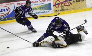 <p>Alex Altenbernd slows a St. Norbert player so teammate Matt Lipinski can get to the puck.  Altenbernd was named to the MIAC all-rookie team along with defenseman Michael Krieg in 2012. (Jake Swansson/TommieMedia)</p> 