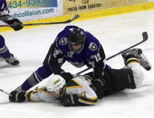 <p>Freshman Alex Altenbernd slows a St. Norbert player.  Altenbernd was named to the MIAC all-rookie team along with defenseman Michael Krieg. (Jake Swansson/TommieMedia)</p> 