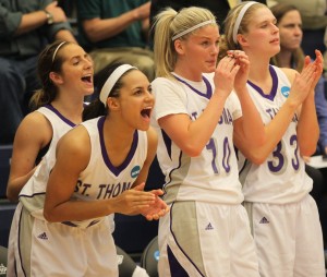 <p> Sophomore Taylor Young (left), junior Kellie Ring (left center), senior Ali Johnson (right center) and freshman Anna Smith (right) cheer during the final seconds of the Tommies consolation victory against Amherst. Young, Ring and Smith will all be key players coming back to play for St. Thomas next season. (Ryan Shaver/TommieMedia)</p>