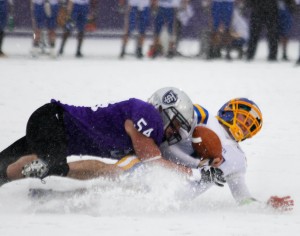 <p>Former St. Thomas linebacker Tony Danna makes a tackle against St. Scholastica in last year's NCAA playoffs. (Rita Kovtun/TommieMedia)</p> 