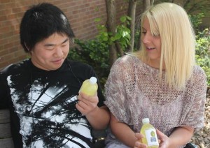 120430_Lemonade Freshman Paige Pipal stops students around campus, such as freshman Nick Willmarth, to pitch her product Late Night Lemonade. Pipal said that simply stopping students and advertising on Facebook and Twitter have been the most effective. (Anastasia Straley/TommieMedia)