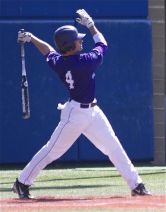 <p>Freshman Jack Hogan finishes his swing in Saturday morning's game against Bethel. Hogan was walked in the fifth, singled in the ninth and hit home by senior third basemen Charles Bruchu in the fifth. (Heidi Enninga/TommieMedia)</p>