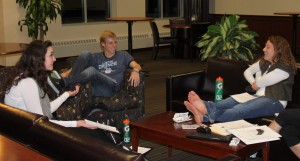 <p>Peer ministers sophomore Emily Casey, sophomore Allen-Michael Muench and sophomore Kaitlyn Gathje gather to talk about the journey groups they're bringing back this semester. The groups decided that they will meet two times per month. (Laura Landvik/TommieMedia)</p> 