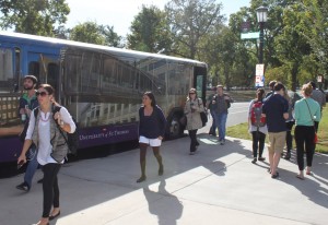 120924_shuttle_changes_Full <p>St. Thomas students get on and off the shuttle bus at the St. Paul campus. The shuttles will be offering an updated card reader to make sure only authorized students are riding. (Laura Landvik/TommieMedia)</p>