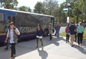 <p>St. Thomas students get on and off the shuttle bus at the St. Paul campus. The shuttles will be offering an updated card reader to make sure only authorized students are riding. (Laura Landvik/TommieMedia)</p> 