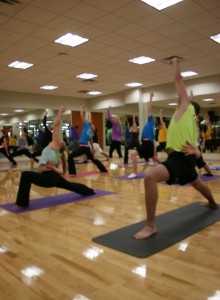 <p>Students hold the warrior pose in the Intermediate Yoga class on Sept. 25. Yoga has been one of the most popular classes offered at the AARC. (Gabrielle Martinson/TommieMedia)</p> 