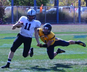 Sophomore quarterback Matt O'Connell orchestrates three touchdowns at Carleton College on Saturday, Sept. 29. O'Connell hit sophomore wide receiver Dan Ferrazzo for a 79 yard touchdown to open the scoring. (Rosie Murphy/TommieMedia)