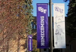 <p>Banners hang near the arches to advertise homecoming. The Alumni Association renamed Taste of Saints, the weekend's pre-football game festivities, homecoming. (Heidi Enninga/TommieMedia)</p>