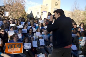 Senior Mark Koranda takes a photo of students in opposition to Minnesota's marriage amendment in the Lower Quad. Junior Chris Gelke organized the event and said about 250 students attended. (Tarkor Zehn/TommieMedia)