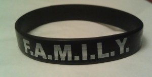 <p>Every player on the football team wears a black family bracelet. The 'F.A.M.I.L.Y' philosophy means "forget about me, I love you." (Photo courtesy of Tyler Erstad)</p>