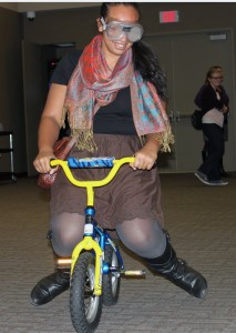 <p>Senior Adaila Dixon attempts to ride a mini bicycle with alcohol impairment goggles on after Residence Life's "Power Hour" program. The goal of the presentation was to have a conversation with students about the dangers and effects of alcohol abuse. (Baihly Warfield/TommieMedia)</p> 