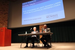 <p>Professor Abdulwahid Qalinle and Professor Robert Vischer converse on the dangers of anti-Sharia laws in the O'Shaughnessy Education Center auditorium Tuesday night. Both professors served as scholars at the "Hot Topics: Cool Talk" forum. (Bjorn Saterbak/TommieMedia)</p> 