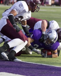 <p>Freshman running back Brenton Braddick gets stopped by the Augsburg defense a yard from the goal line. On the next play, freshman running back Dominic Truoccolo finished the drive with a touchdown run, bringing the score to 30-7 Tommies. (Meg Thompson/TommieMedia)</p> 