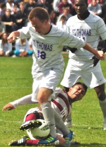 <p>Freshman forward Ryan Bernhardt captures the ball from junior Augsburg College's junior forward Ryan Schlittler. St. Thomas finished off the season with an overall record of 11-4-3 and secured a spot in the MIAC playoffs. (Ali Stinson/TommieMedia) </p> 