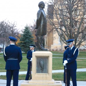 <p>Seniors Jay Denny and Cole Johnson and sophomores Lincoln Schmidt and Jessica Gartland gather around the Arch Bishop John Ireland statue before the official flag rising Saturday. Each year, ROTC students march around the flagpole on North Campus for 24 hours, honoring those who have served the country. (Kayla Bengtson/TommieMedia)</p>