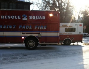 <p>Rescue vehicles idle at the corner of Cleveland and Selby, where the father of a St. Thomas student slipped and was injured in a fall Monday morning. (Alyssa Adkins/TommieMedia)</p> 