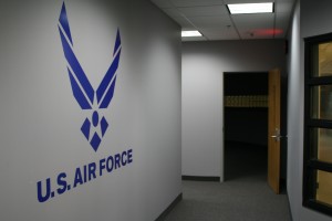 <p>The Air Force symbol can be seen in the display window facing the hallway of MHC. This area includes a reception area, offices, a computer room, a library, two classrooms and a storage area. (Laura Landvik/TommieMedia)</p>