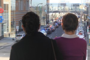 <p>Two Target employees, who asked not to be identified, look from a St. Thomas skyway toward the building where someone reported hearing shots Friday. Police said they found no evidence of a shooting. (Alex Goering/TommieMedia)</p> 