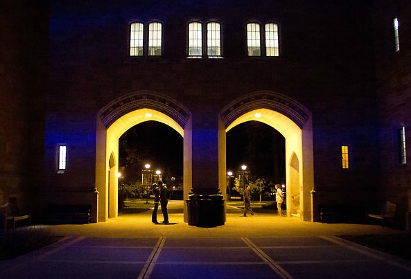 11:59 p.m. A couple has less than a minute left to wait to partake in the True Tommie tradition of kissing under the arches at midnight. (Rita Kovtun/TommieMedia)