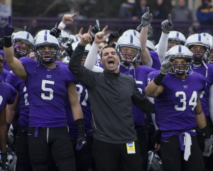 <p>Safety Tyler Erstad, coach Glenn Caruso, and running back Brenton Braddock lead the Tommie victory song after defeating Hobart 47-7 Saturday. The Tommies advanced to the national semifinal for the second consecutive year last December. (Meg Thompson/TommieMedia)</p>