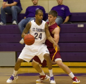<p>Guard John Nance pushes against a Concordia defender. Nance shot 6-for-7 from the charity stripe and led the team with 15 points. (Jesse Krull/TommieMedia)</p>