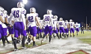 <p>The St. Thomas football team enters Salem Stadium for the 2012 NCAA Stagg Bowl Dec. 14. The Tommies competed against the top-ranked Purple Raiders. (Rosie Murphy/TommieMedia)</p>