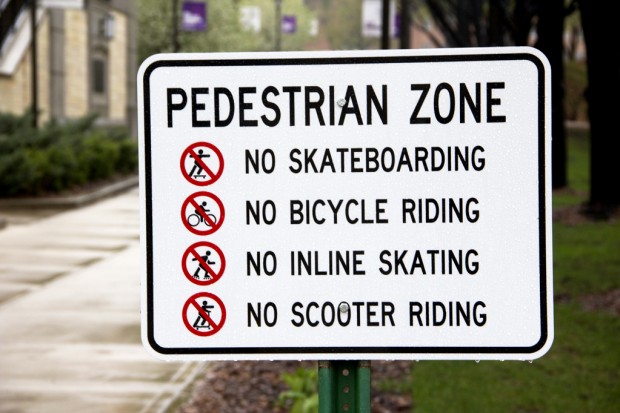 This is one of two signs that has been put up at the end of the thoroughfare between the Upper Quad and Lower Quad. According to Public Safety, the goal of the signs is to make campus safer for students. (Photo credit: TommieMedia)