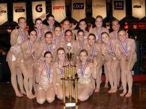 <p>The dance team poses with their national first place trophy for the Universal Dance Association's open jazz category. The win marked the team's first consecutive title in the open jazz category from last season to this season. (Photo courtesy of the St. Thomas dance team)</p>