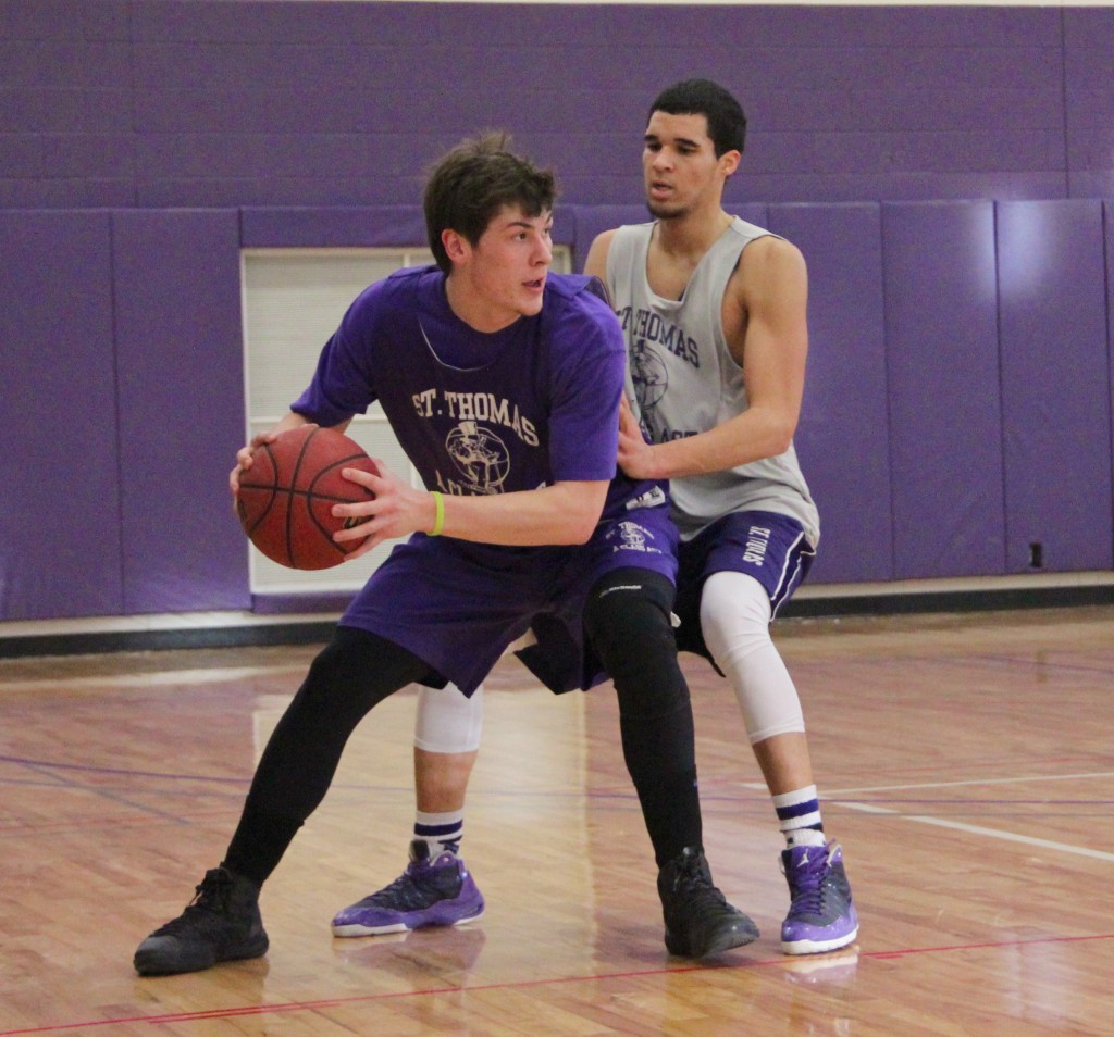 Taylor Montero holds off a defender during practice. Montero returned from a torn ACL in 2011 and is averaging 13.7 minutes per game for the Tommies. (Eden Checkol/TommieMedia)