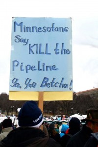 Minnesotans raise signs to show their oppositions toward the Keystone XL pipeline in Washington, D.C. Juniors Carly Dent and Claire Krebs were two St. Thomas representatives who attended the protest. (Kayla Bengtson/TommieMedia)