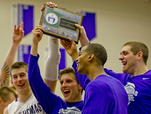 The St. Thomas men's basketball captains proudly display their MIAC playoff championship plaque. It was the Tommies' third-straight MIAC playoff title. (Andrew Stafford/TommieMedia)